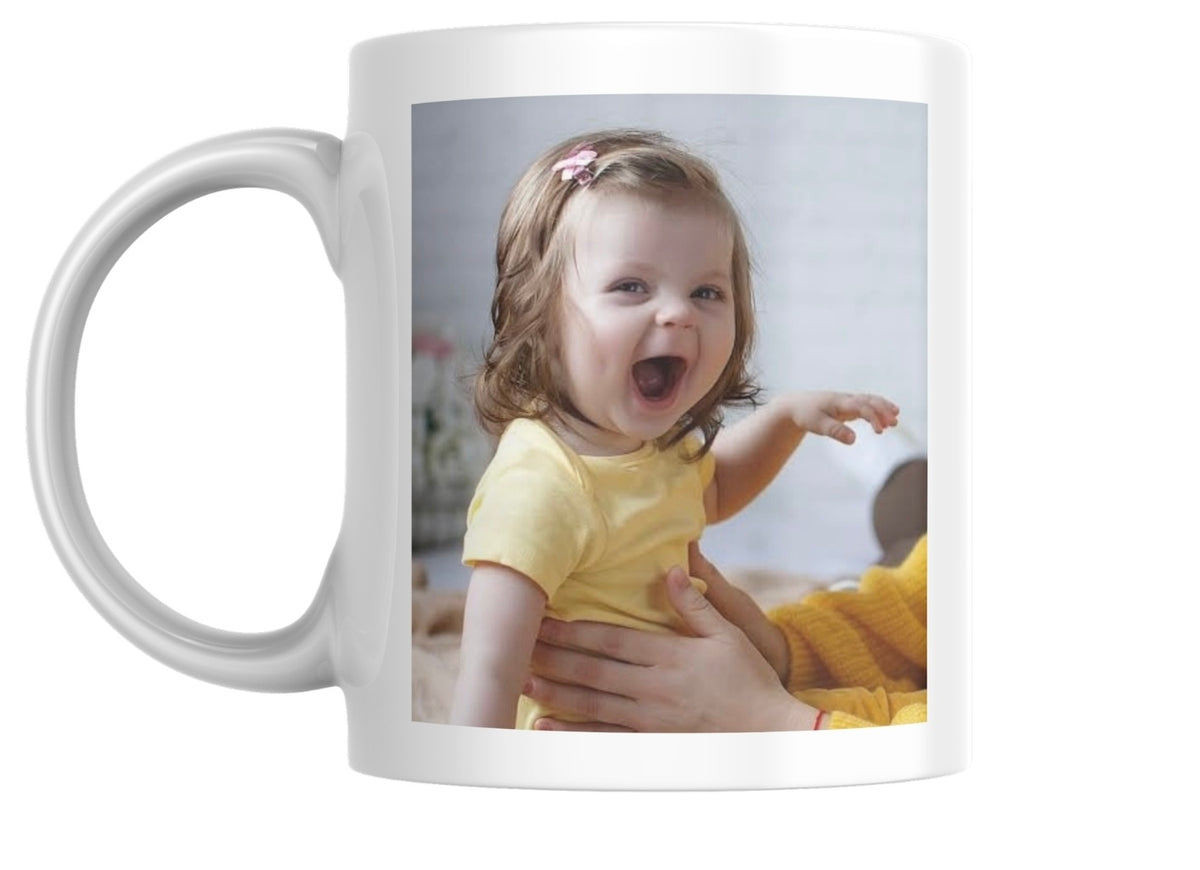White mug with a photo of a child on it