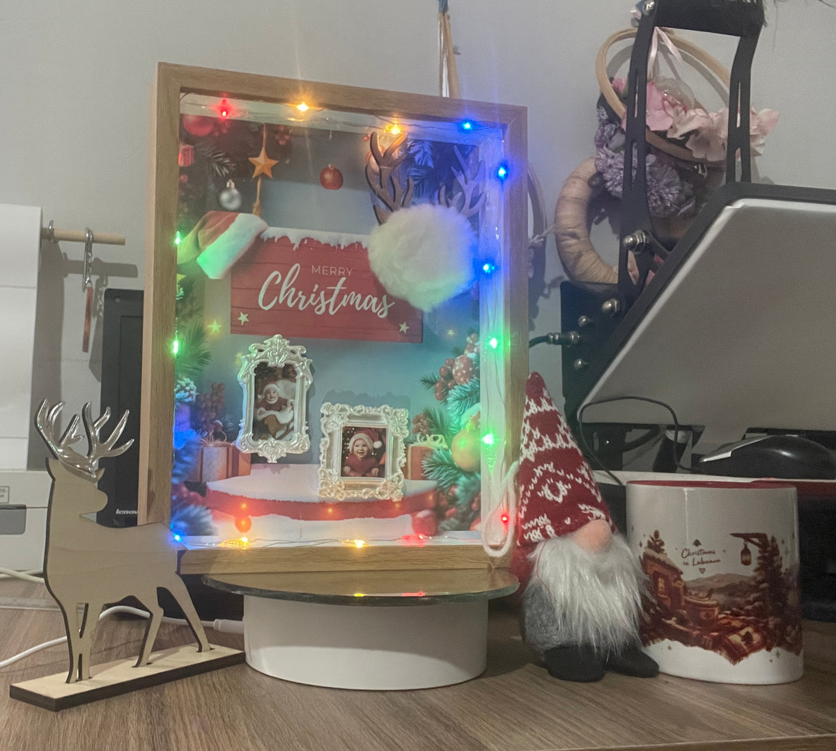Wood-look Christmas shadow box with multicoloured lights, Merry Christmas design and two miniature portrait frames