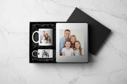 Gift set with mug, keychain, and photo album on a marble surface