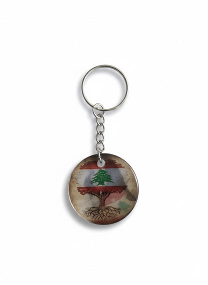 Keychain with Lebanon tree design on a white background
