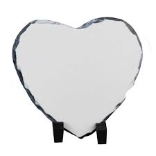 Heart-shaped white stone on a black stand against a white background