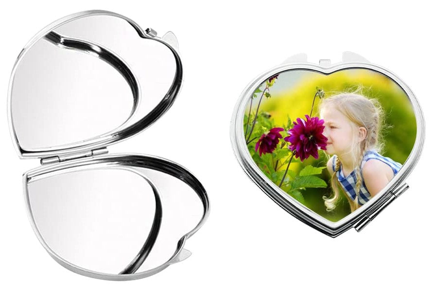 Heart-shaped compact mirror with a photo of a girl in nature on a white background
