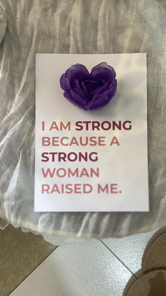 Card with purple heart-shaped object and motivational text on a neutral background