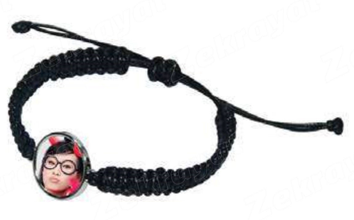 Black braided adjustable-style bracelet with oval photo charm on a white background