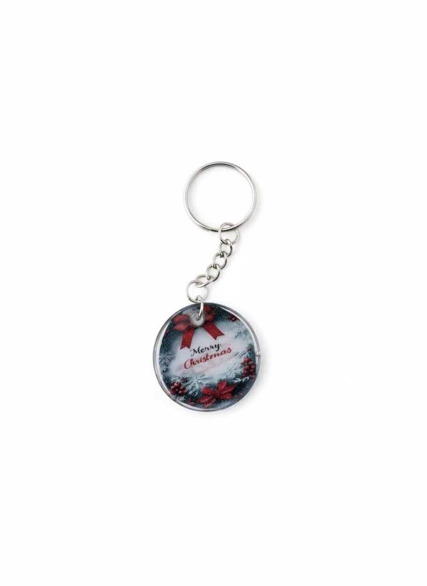 Christmas-themed keychain with 'Merry Christmas' text on a white background